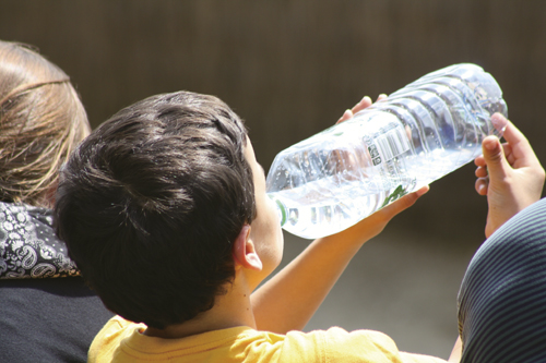 Boy drinking water from a bottle